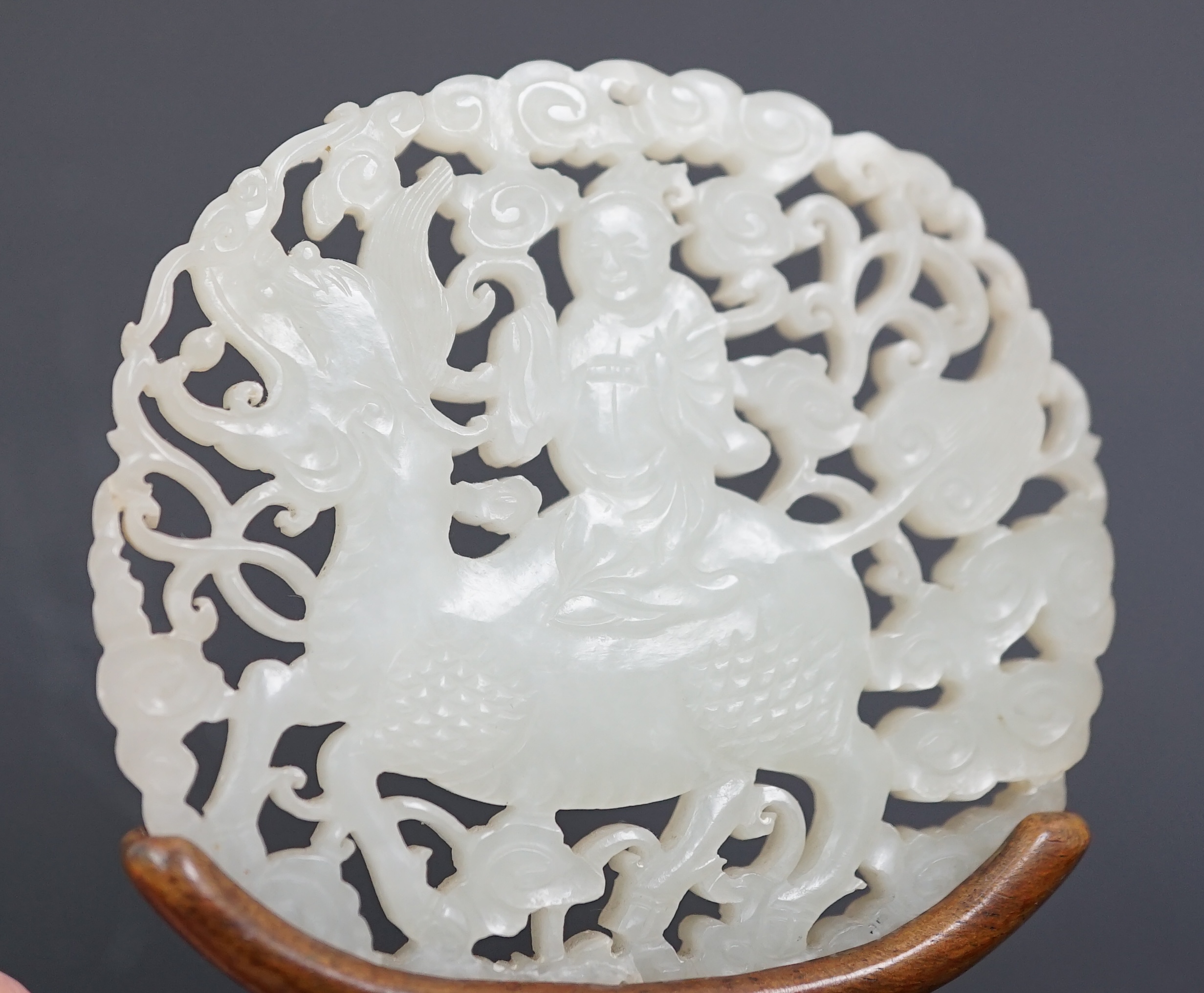 A Chinese white jade ‘qilin and rider’ plaque, 18th/19th century